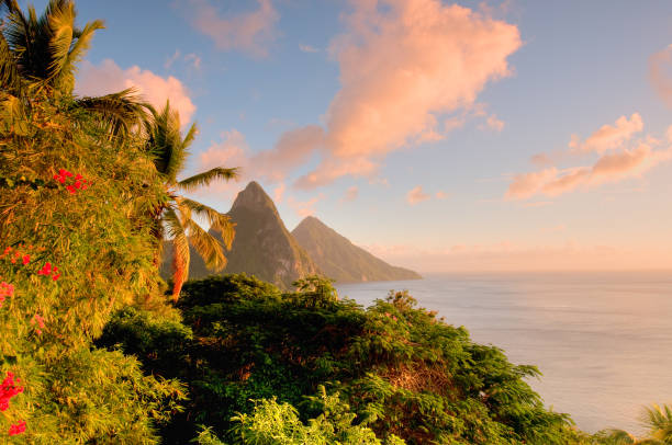 St. Lucia's Twin Pitons lit by sunset glow stock photo