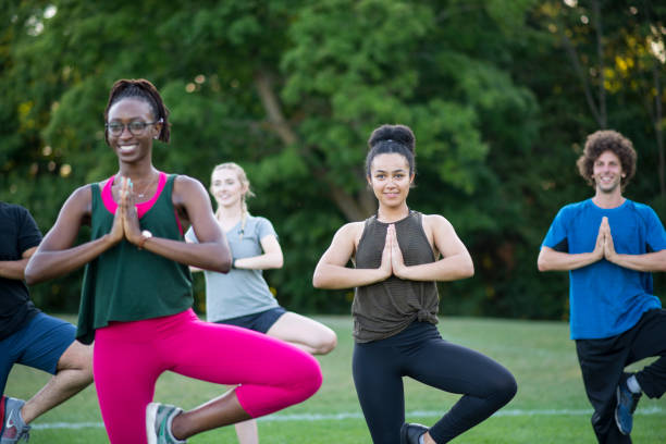 istock Group of People Balancing in a Fitness Program 1554197263