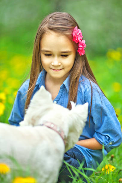 istock Little girl with dog 155419795