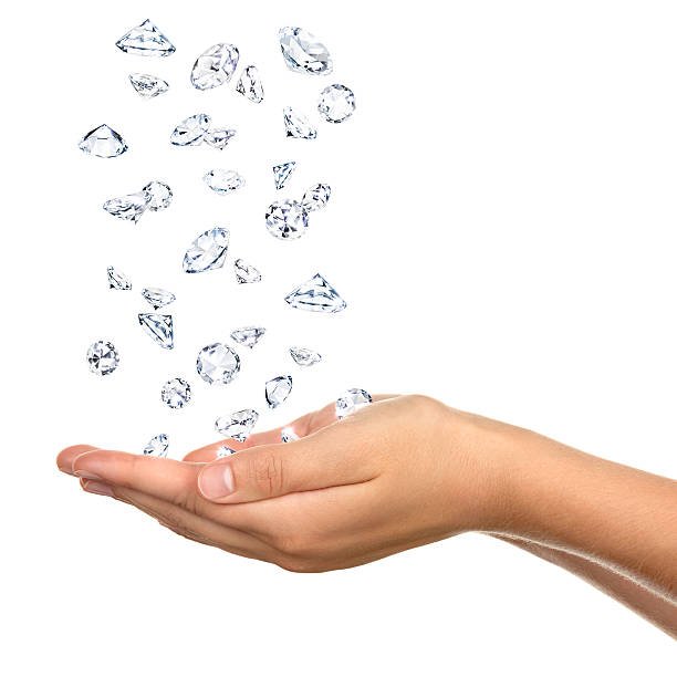 Pair of Cupped Female Hands Catching Falling Diamonds Isolated