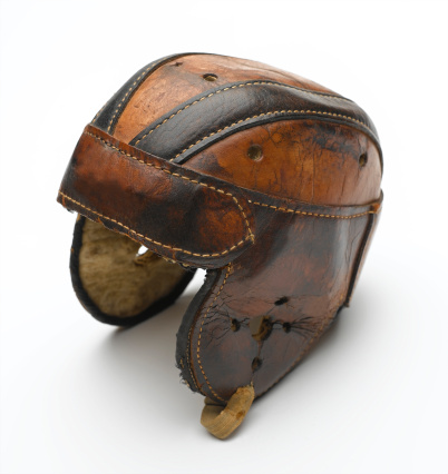 An old antique leather football helmet from the early days of American football.