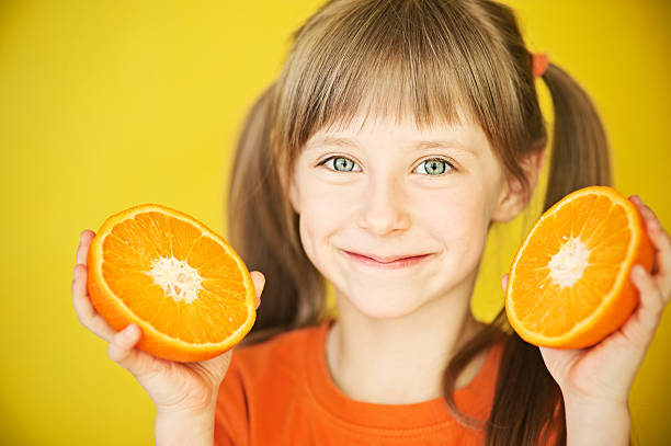 istock Little girl with orange 155420331