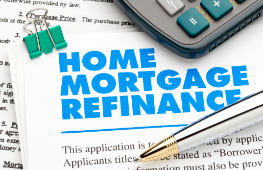 Home Mortgage Refinance Application and pen and calculator. ++All numbers and text are fictitious++