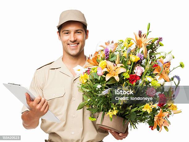 Delivery Man Holding Bouquet Of Flowers And Clipboard Isolated Stock Photo - Download Image Now