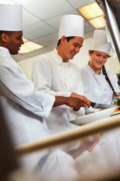 istock Chefs preparing dishes in a restaurant's commercial kitchen 155420874
