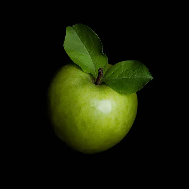 Photo of Green apple isolated on black background