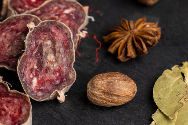 istock Unpeeled sliced salami using beef meat with spices 1554210486