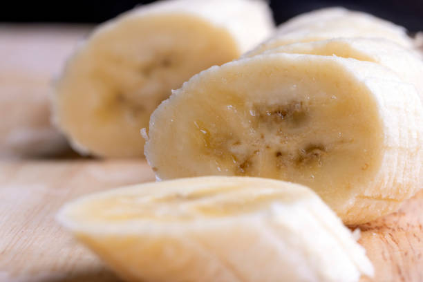 istock Sliced ripe banana on a cutting board 1554210592