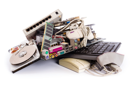 heap of electronic and computer hardware waste for disposal or recycling - junked computer parts