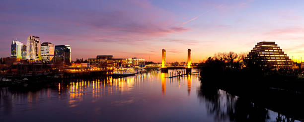 Downtown Sacramento skyline  after sunset A panorama of the downtown Sacramento, California skyline just after sunset, including the Tower Bridge and the Ziggurat Building. sacramento stock pictures, royalty-free photos & images
