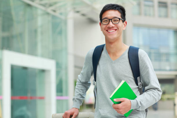 istock picture of young college student looking at camera smile 155421463
