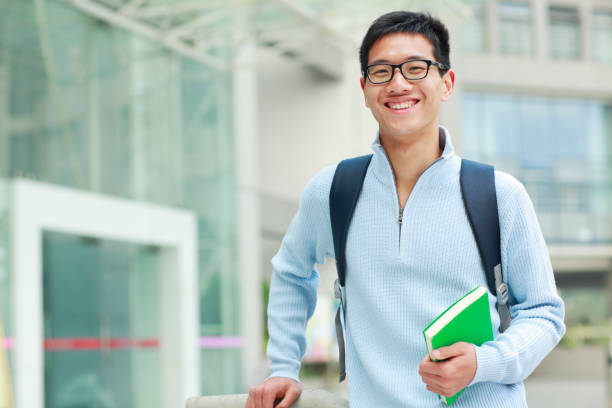 istock young asian college student looking at camera smile 155421465