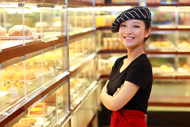 istock portrait of happy young baker in the bakery 155421881