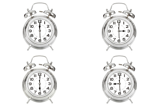 Alarm clocks with different times-isolated on white background