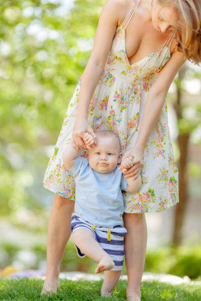 istock happy boy walking with mom 155422298