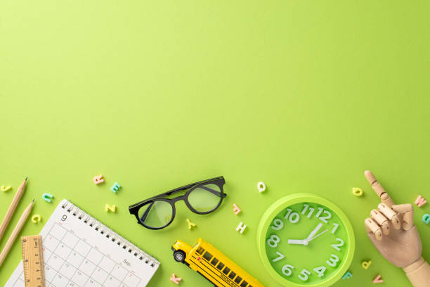 istock Embark on the educational process with this top-down photo showcasing calendar and other school supplies on isolated light green background. Copy-space allows for personalized text or advertisements 1554241624