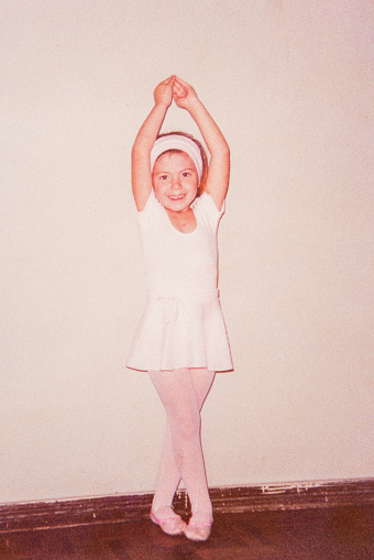 Vintage portrait of girl with ballet costume at home going to dance academy in the 90's in Brazil.