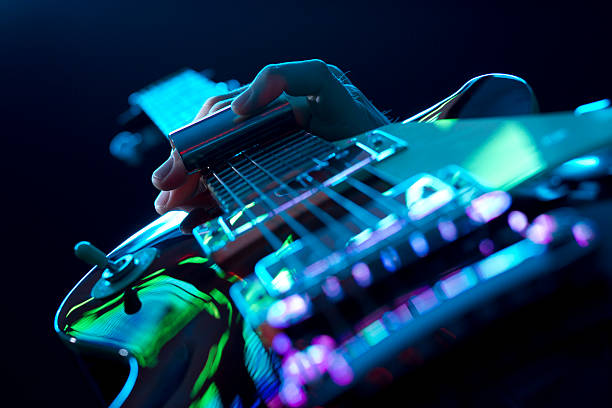 Guitarist Playing Slide Guitar Rock/Blues Guitar Player on Stage, Slide Guitar electric guitar photos stock pictures, royalty-free photos & images