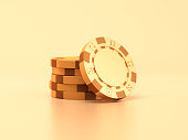 Gold casino chips on a golden background