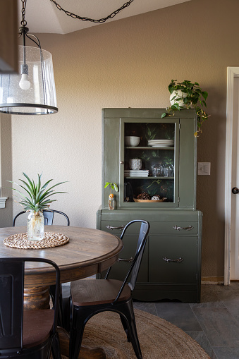 Vintage green hutch in dining room