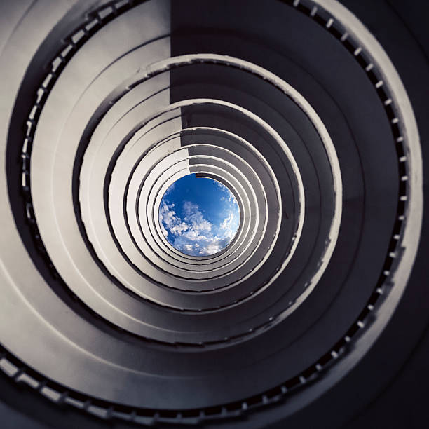 istock Old spiral stairway from below 155427668