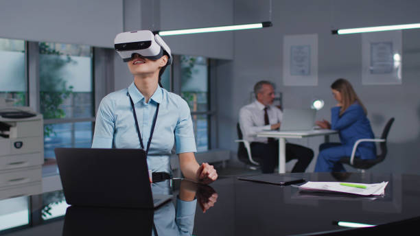 istock Asian female engineer in virtual reality goggles working in modern office 1554278317