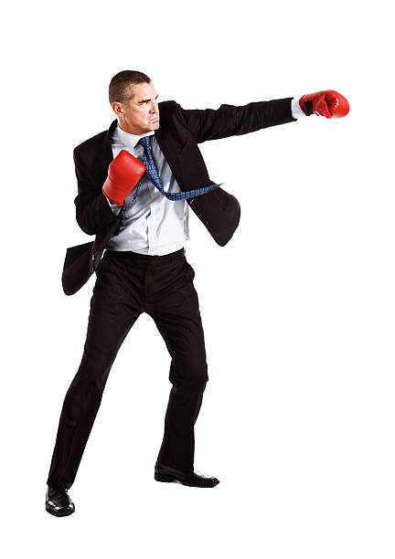 ビジネスマンを着ているハンサムなしかめっ面ボクシンググローブは、攻撃 - boxing caucasian men business ストックフォトと画像
