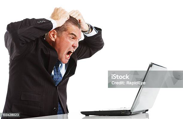 Furious Frustrated Businessman Loses Temper With Laptop Stock Photo - Download Image Now