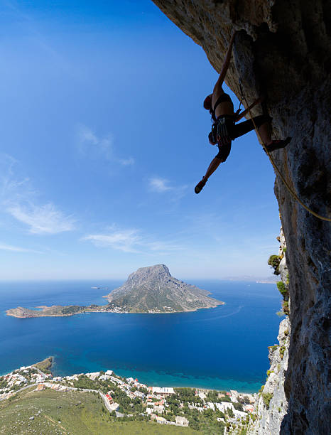 istock Woman rockclimbing silhouette 155428037