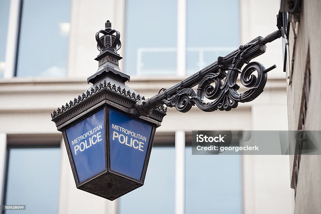 Metropolitan Police Lantern in London Close-up of a traditional police lantern, on display outside a police station in central London, England. Police Force Stock Photo