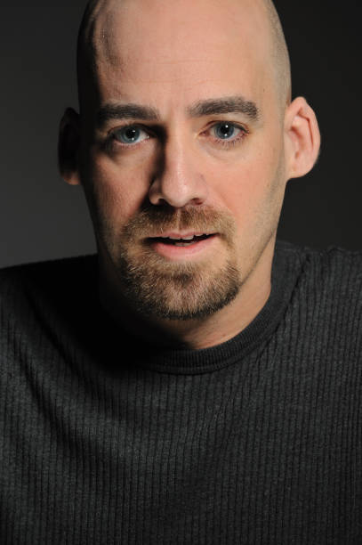 istock Young man with goatee and shaved head 155428133
