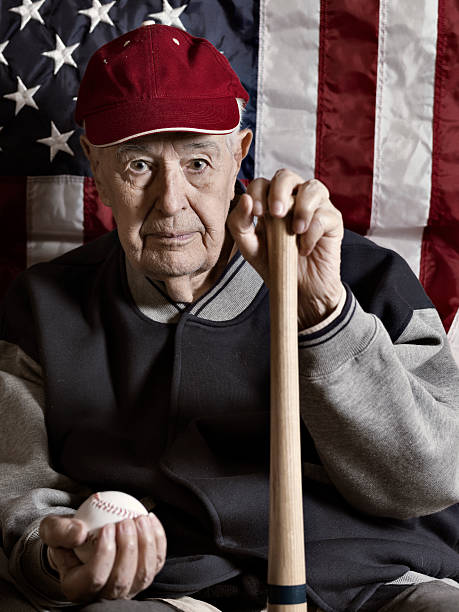 シニアます。旧野球選手 - baseball player american flag sport men ストックフォトと画像