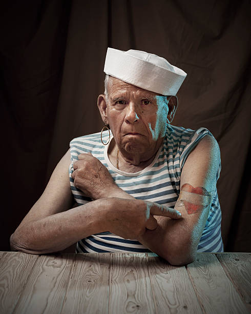 Sailor grandfather Old mad showing his tattoos tattoo arm stock pictures, royalty-free photos & images