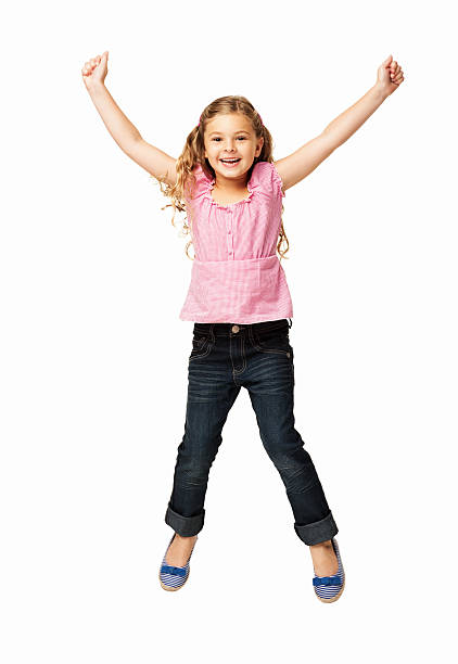 Bambina felice saltando-isolato - foto stock