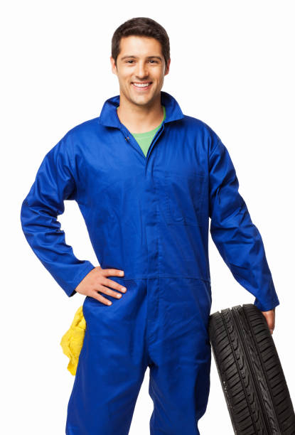 istock Automotive Technician Holding a Spare Tire - Isolated 155428614