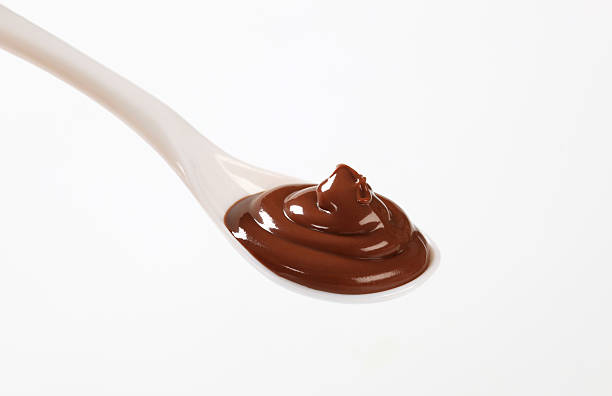 A white spoonful of chocolate mousse stock photo