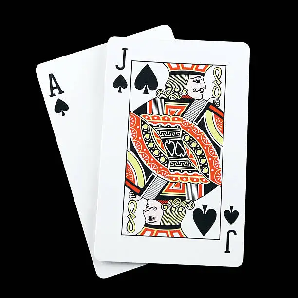 Blackjack hand isolated on black showing a winning combination