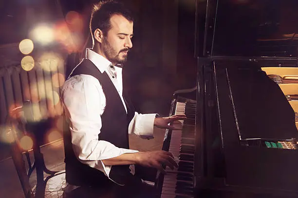 Photo of handsome piano player