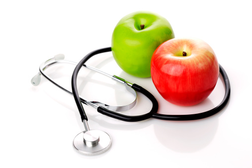 Stethoscope and Apples on a White Background