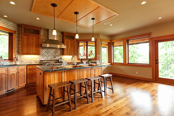Open-plan kitchen with wooden cabinets and walnut floor