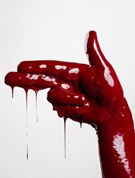 Bloody War Hand covered of liquid paint making a gun sign. blood drop stock pictures, royalty-free photos & images