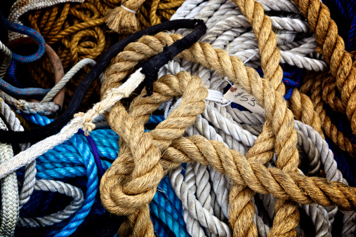 Background of a Pile of Used Rope in assorted sizes and colors for sailboats, motorboats, and all nautical uses, line