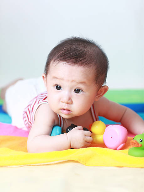 istock Cute asia baby on the bed 155429507