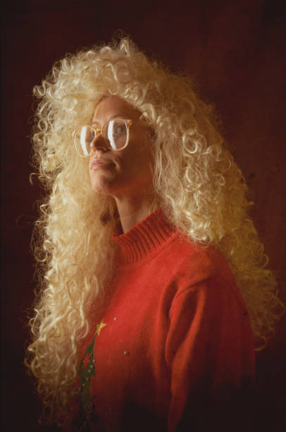 Faded Glamour Shot Yearbook Photo A young woman with huge curly blonde hair and 1980s sweater and glasses, looks smug as she poses for his high school portrait senior year.  She's wearing a red sweater with a Christmas tree on it.  Vertical.  INTENTIONAL DEGRADATION OF IMAGE AND LIGHTING FOR VINTAGE FEEL.

[URL=http://www.istockphoto.com/search/lightbox/14244318#1330f91f][IMG]http://i186.photobucket.com/albums/x196/hybridsoul2/GlamShots_zpse93f7039.jpg[/IMG][/URL]

[url=http://www.istockphoto.com/file_search.php?action=file&lightboxID=11262412#1a596637][IMG]http://i186.photobucket.com/albums/x196/hybridsoul2/WeirdChristmas.jpg[/IMG][/url]

[url=file_closeup?id=13151863][img]/file_thumbview/13151863/1[/img][/url] [url=file_closeup?id=13151865][img]/file_thumbview/13151865/1[/img][/url] [url=file_closeup?id=23547796][img]/file_thumbview/23547796/1[/img][/url] [url=file_closeup?id=18705837][img]/file_thumbview/18705837/1[/img][/url] [url=file_closeup?id=19526949][img]/file_thumbview/19526949/1[/img][/url] school picture stock pictures, royalty-free photos & images