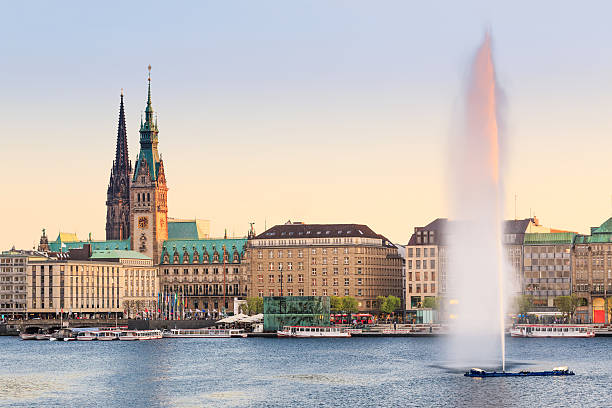 Hamburg Alster Lake, Town hall The Lake Binnenalster in Hamburg in Germany during spring time. In the toreground the famous Alter Lake fountain. hamburg stock pictures, royalty-free photos & images