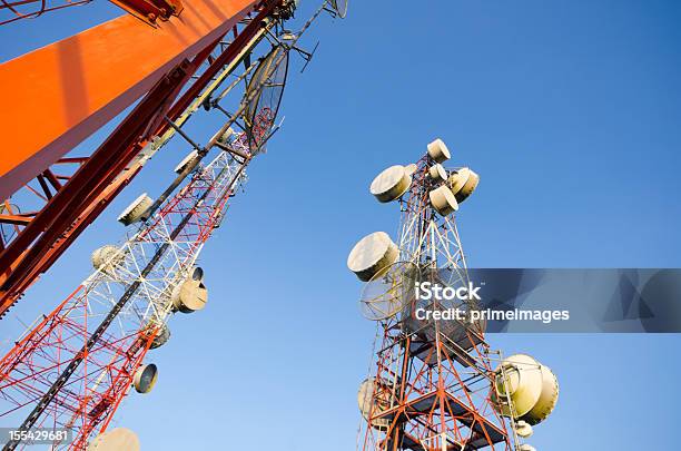 Telecommunication Tower Against The Blue Sky Stock Photo - Download Image Now - Advice, Antenna - Aerial, Architectural Column