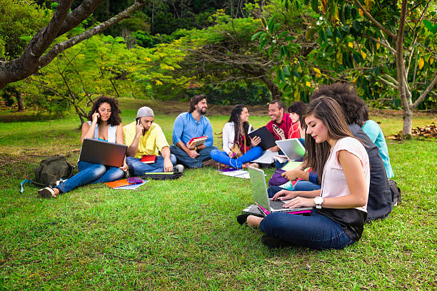 istock Group of college students studying at university campus 155429797