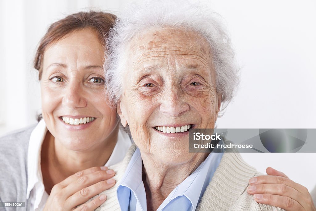 Senior woman and caregiver Senior woman with her home caregiver 80-89 Years Stock Photo