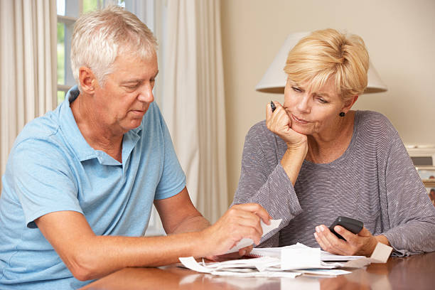 istock Worried Mature Couple Checking Finances And Going Through Bills 155430511