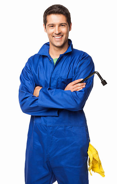 Automotive Technician Standing With Arms Crossed - Isolated stock photo